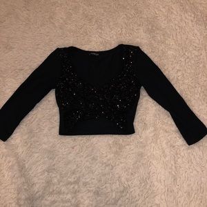 Bebe black sequined crop top